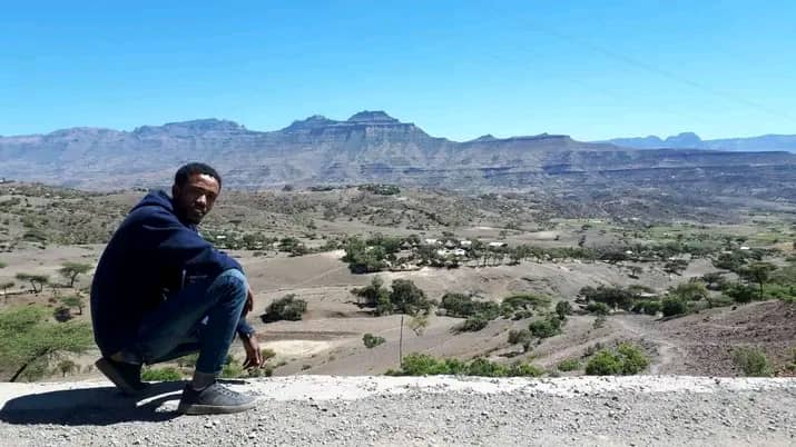 Sisay with the Lalibela landscape behind him