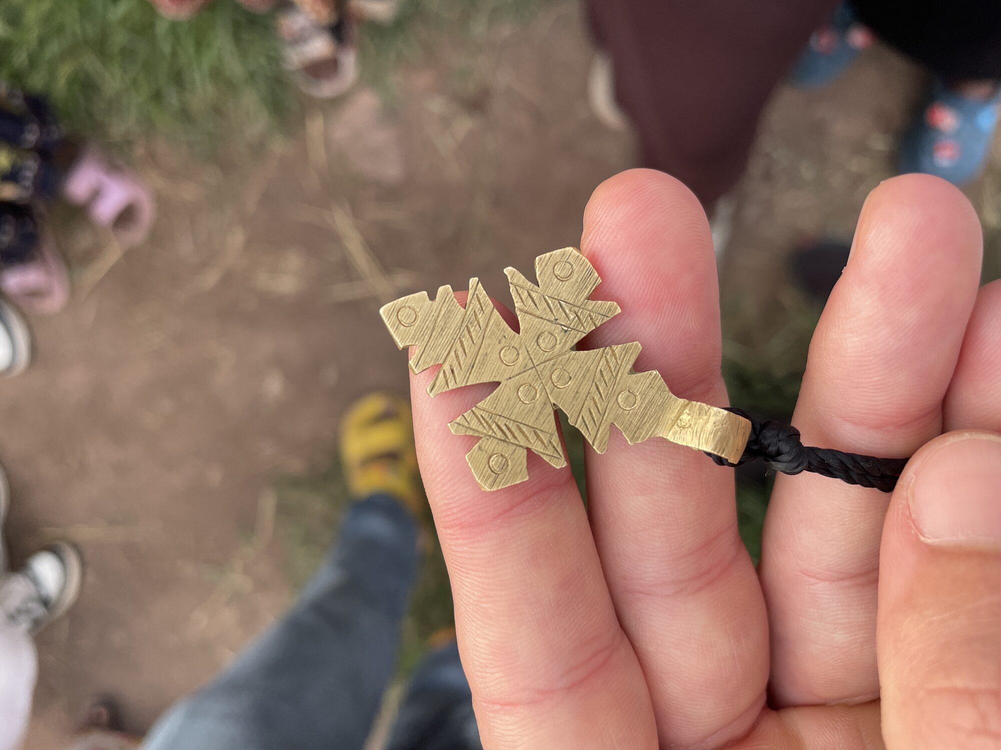 Close-up of a handmade Ethiopian cross necklace