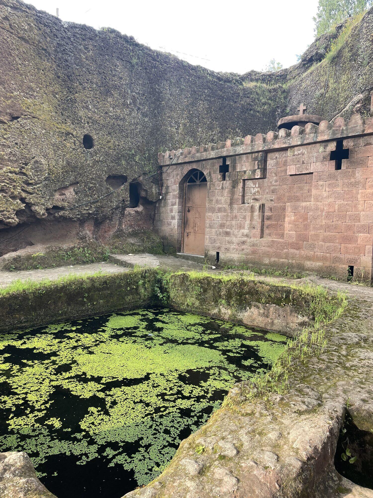 Baptismal pool carved from rock at one of Lalibela's churches