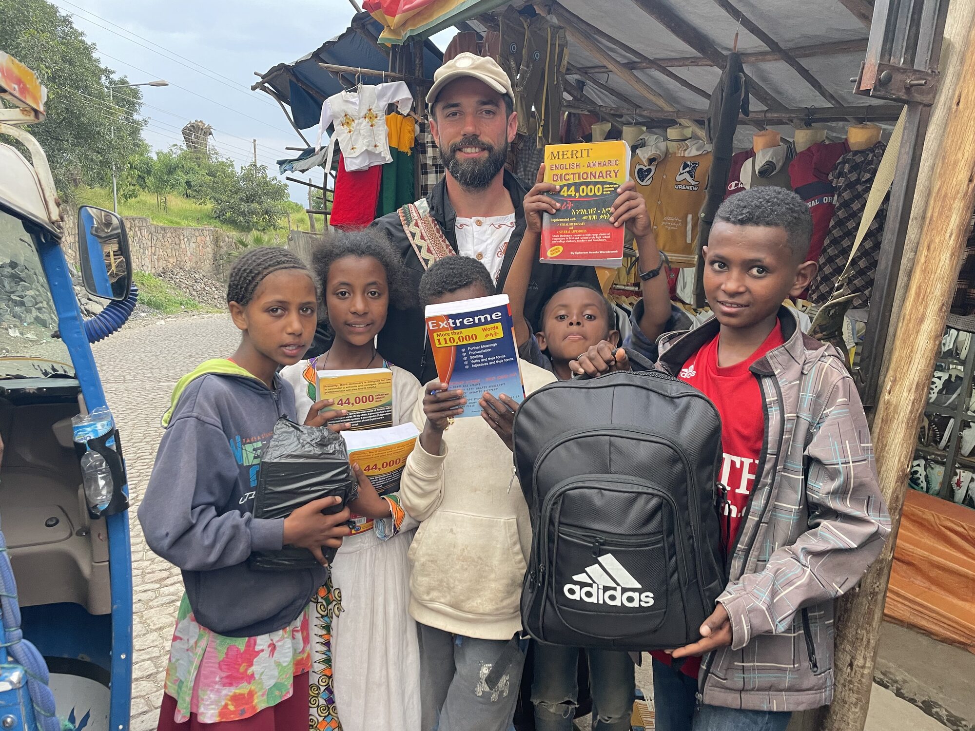 Giving dictionaries to children in Lalibela
