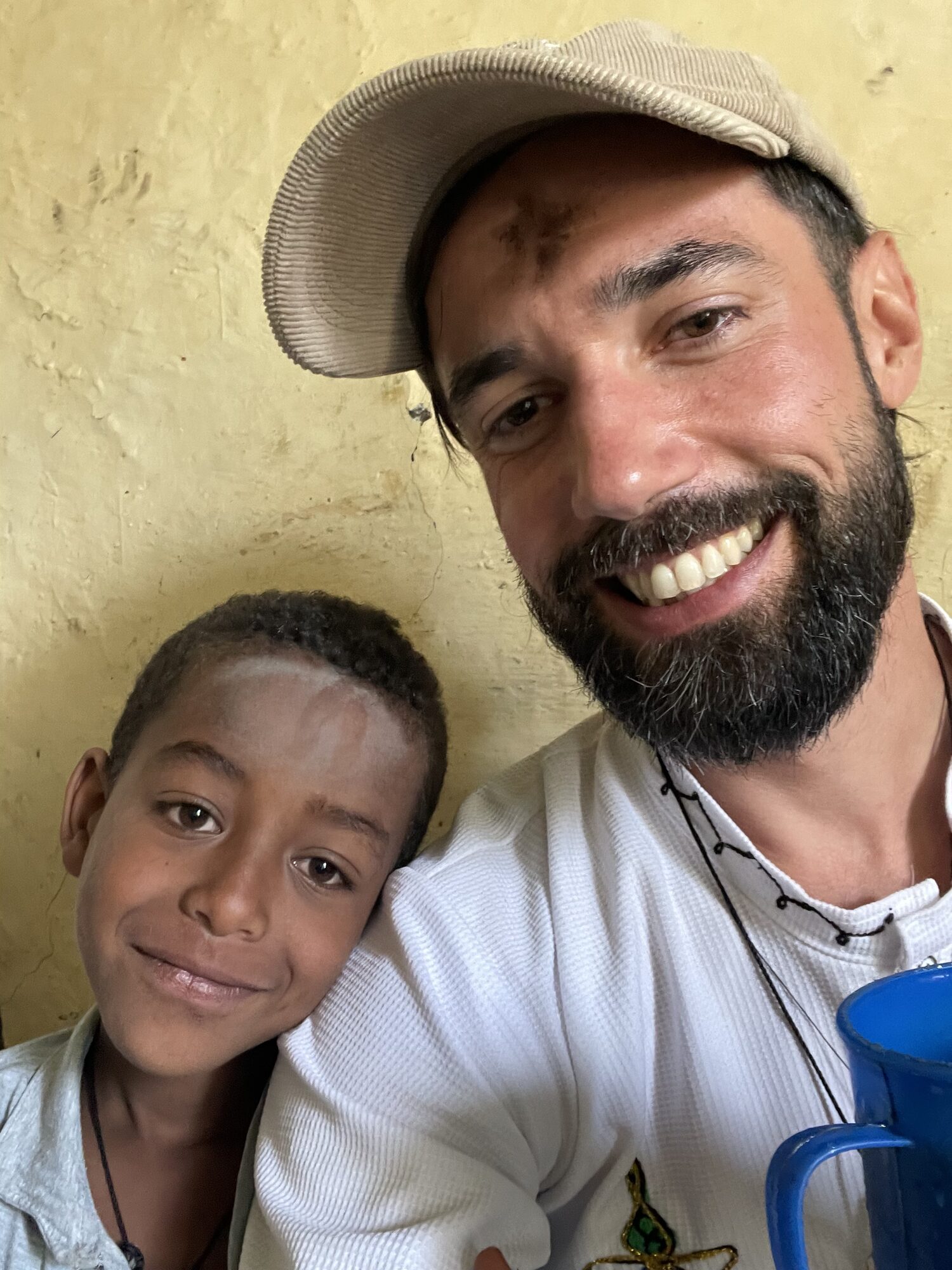 Sharing a meal with a child in Lalibela