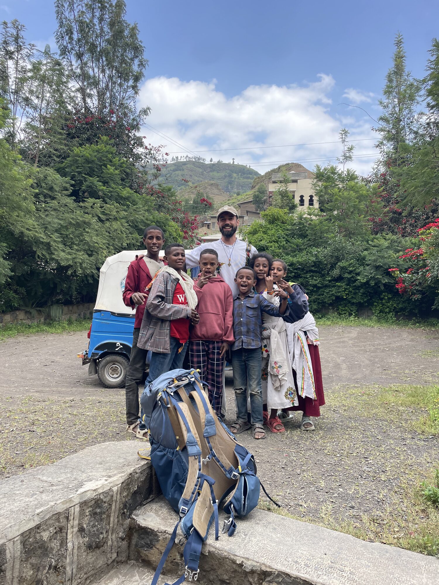 Antonin and children standing together in town