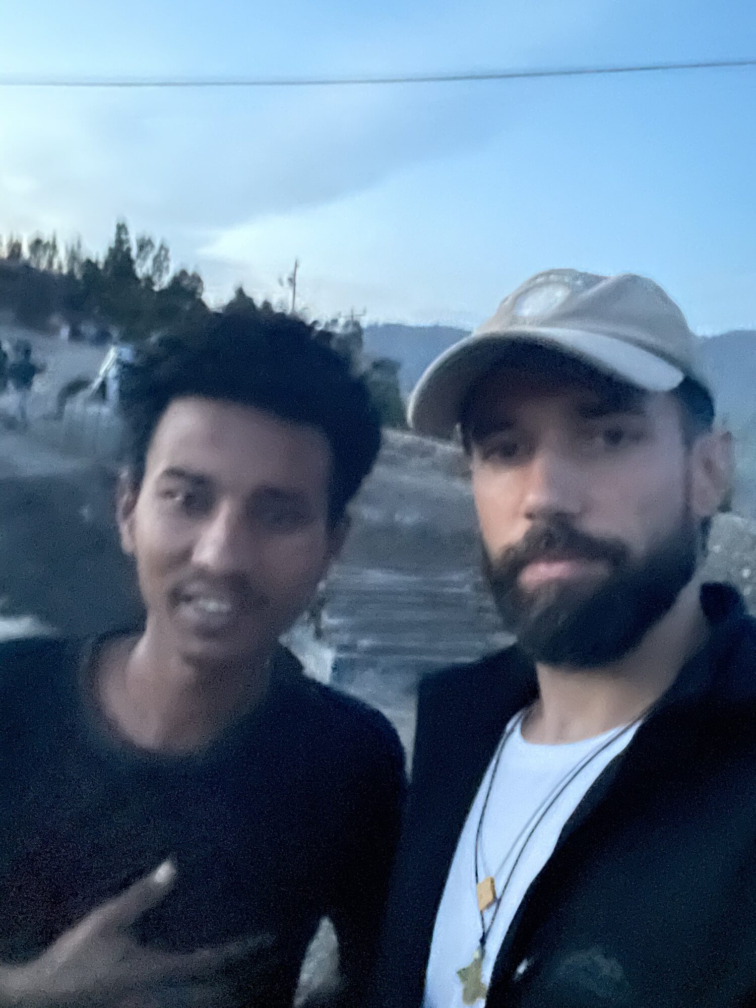 Antonin with locals in Lalibela at dusk — warmth and friendship